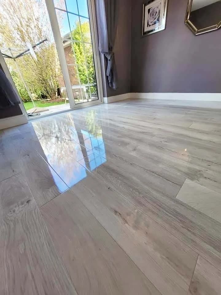 Light oak high gloss laminate in a room with full-height garden doors