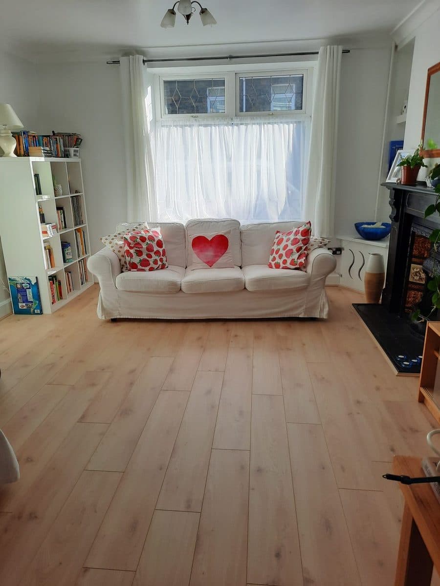 Light oak laminate flooring in a bright living room