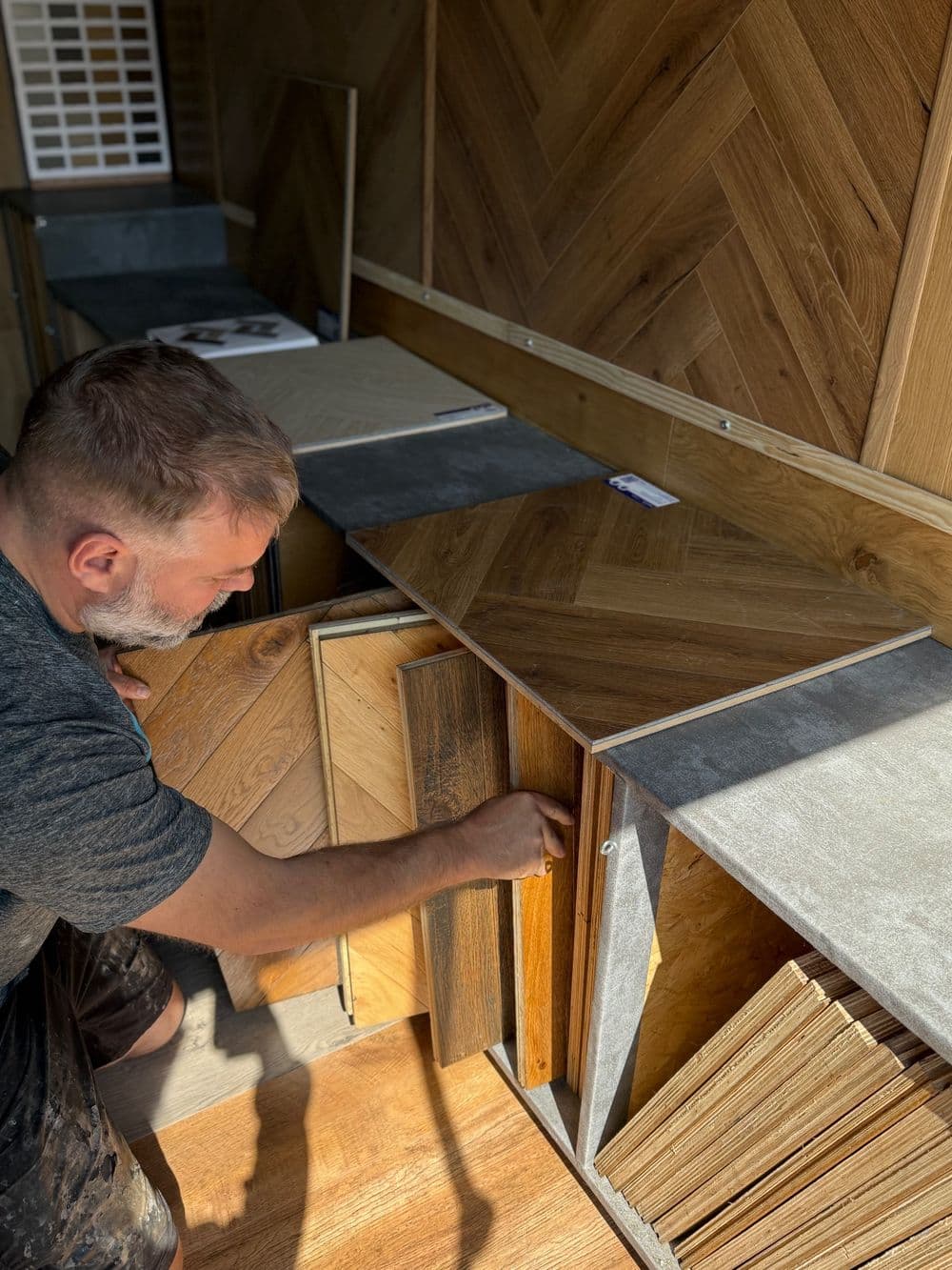 Flooring sample boards stored in the mobile showroom's pull-out racks